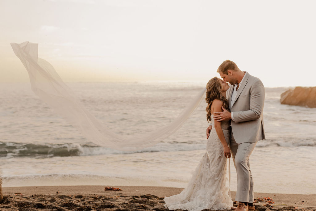 beach wedding photos with bride and groom