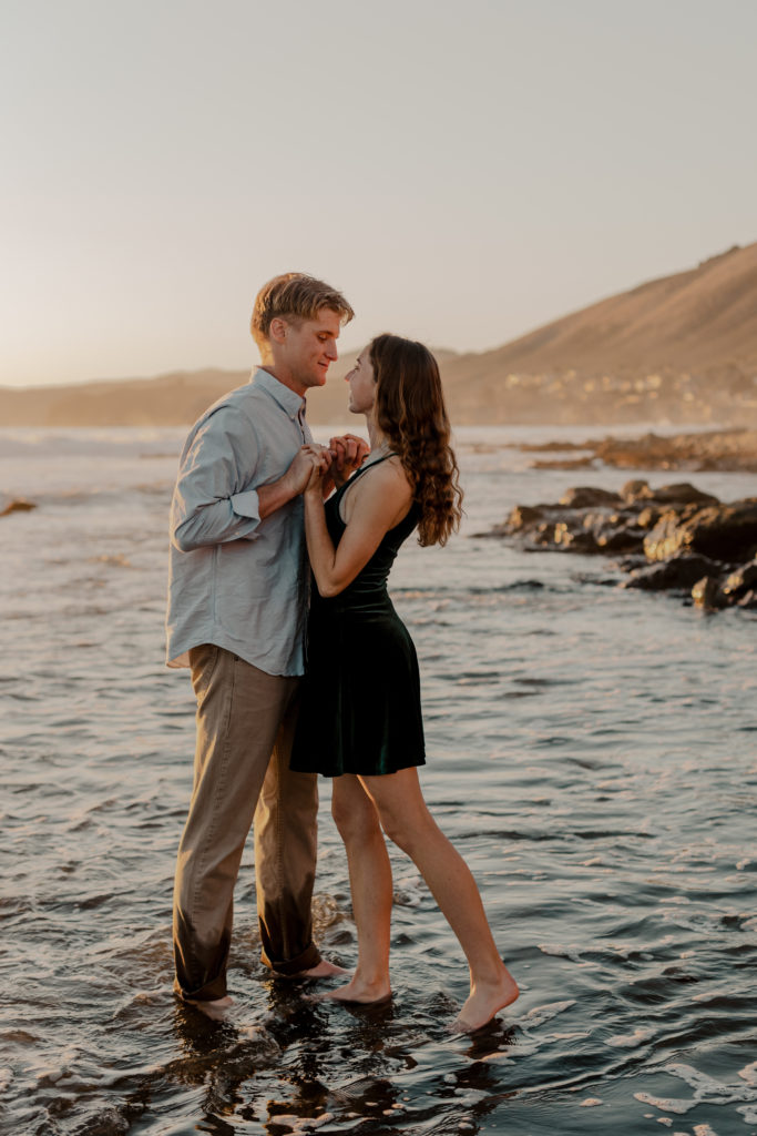 beach engagement photoshoot | shell beach engagement session | couple playful on beach