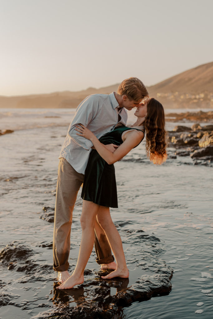 beach engagement photoshoot | shell beach engagement session | couple playful on beach