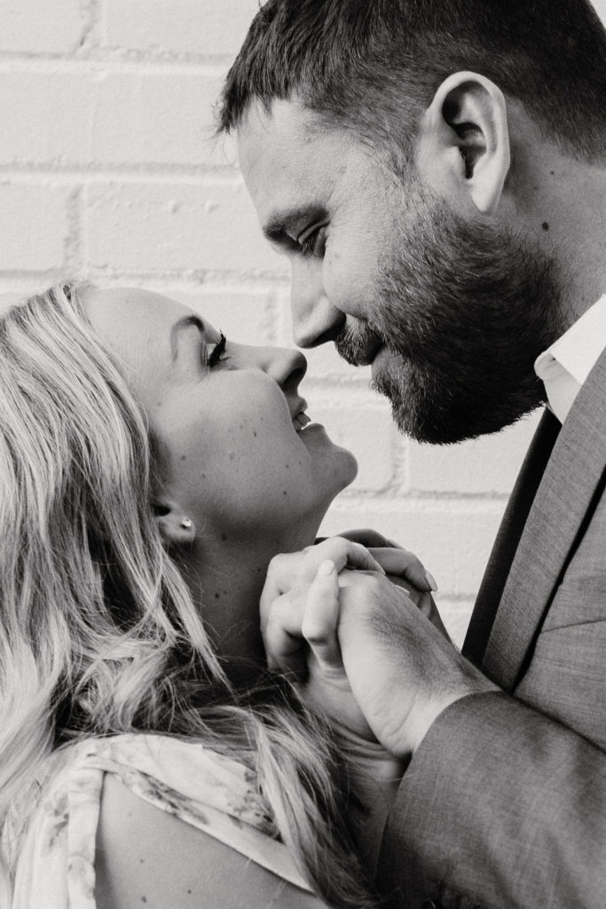 couple kissing at engagement photoshoot