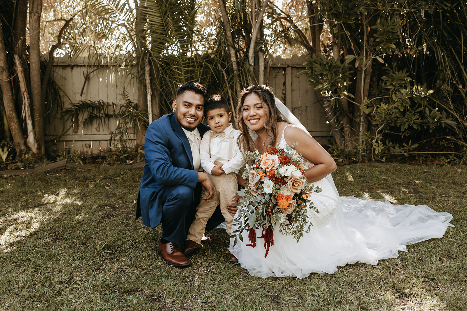 bride and groom and child