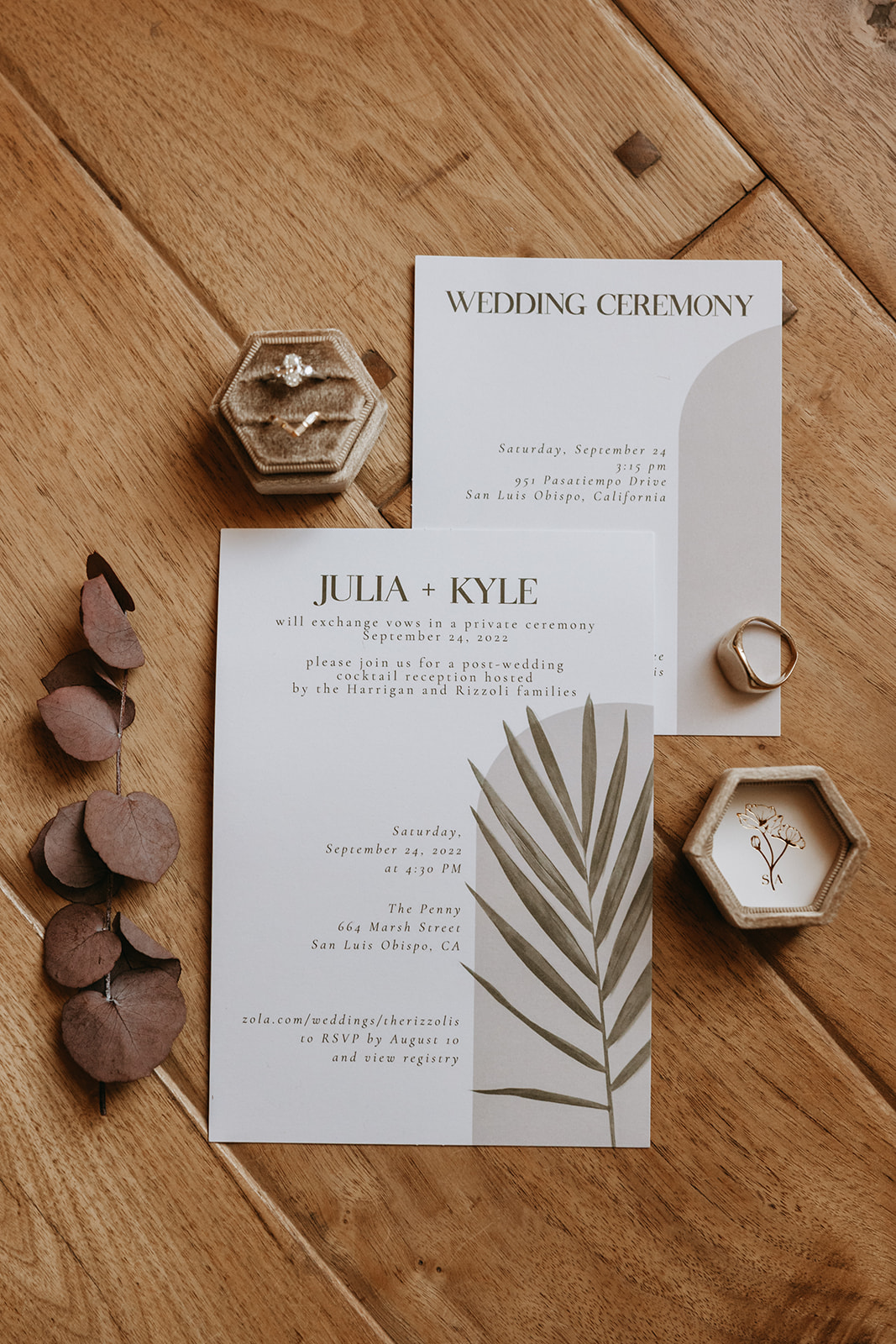 wedding day details with the invitation and the rings | The Penny: A Downtown Wedding Venue in San Luis Obispo