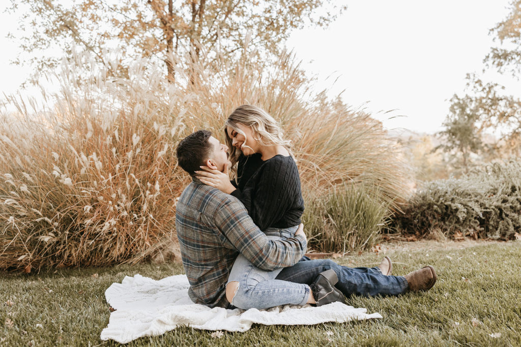 couple posing for their outdoor engagement photos