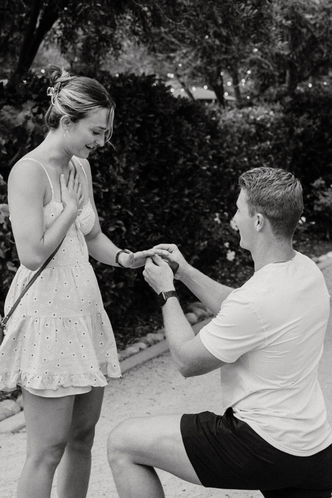 couple posing after a surprise proposal