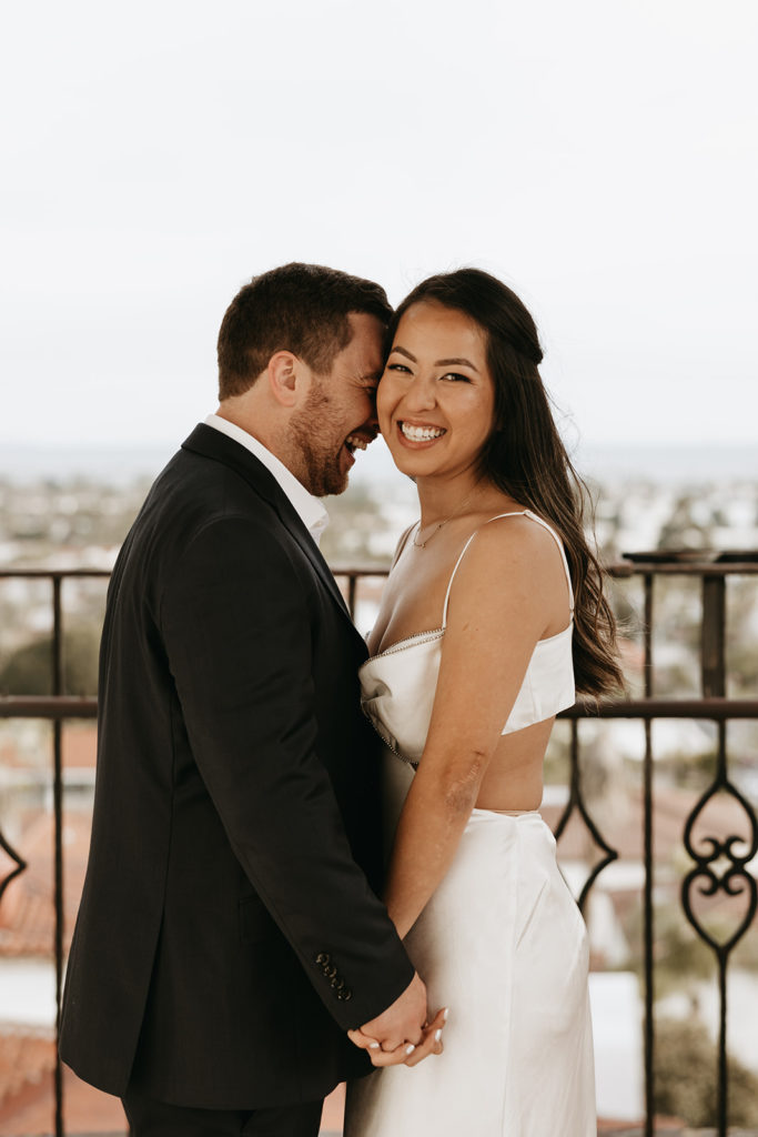 couple posing for their elopement photos at a courthouse in santa barbara
