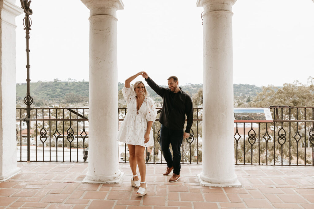 couple posing for engagement photos in santa barbara to prepare for their wedding
