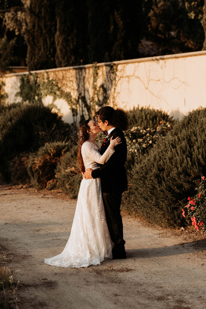 bride and groom posing in a california winery for their wedding portraits