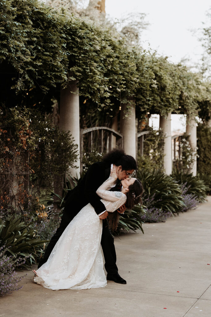 bride and groom posing for their calipaso winery and villa wedding in california
