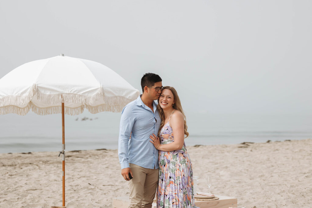 couple on the beach in santa barbara for a surprise proposal
