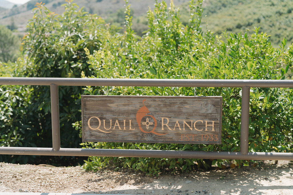 wedding venue sign at elegant garden wedding at Quail Ranch in Simi Valley