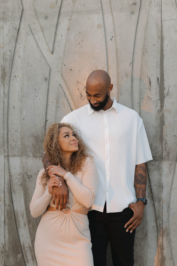 toni and dez posing for an engagement photoshoot in central california