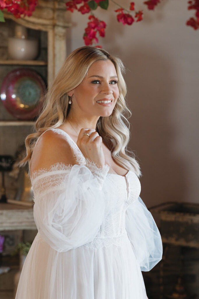 woman trying on her wedding gown
