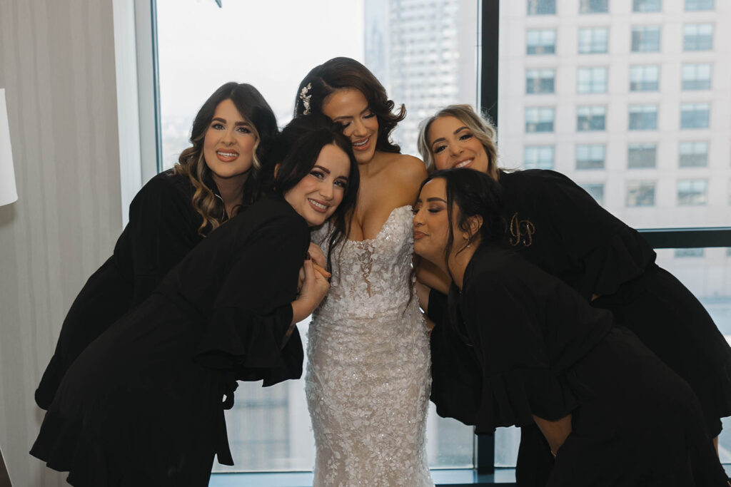 bride putting on her wedding dress
