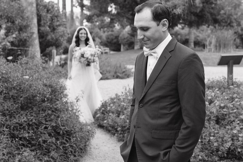 couple posing for  a first look
