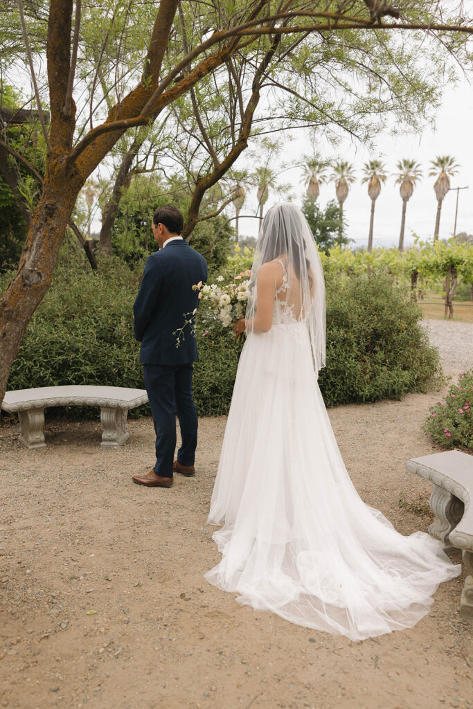 couple posing for  a first look
