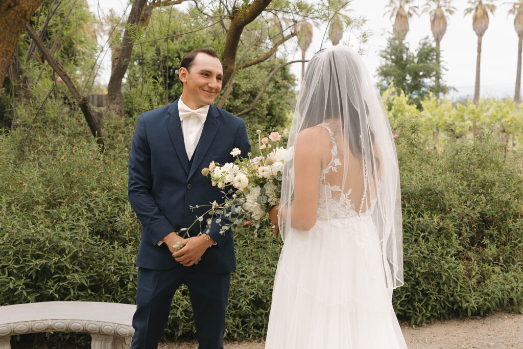 couple posing for  a first look
