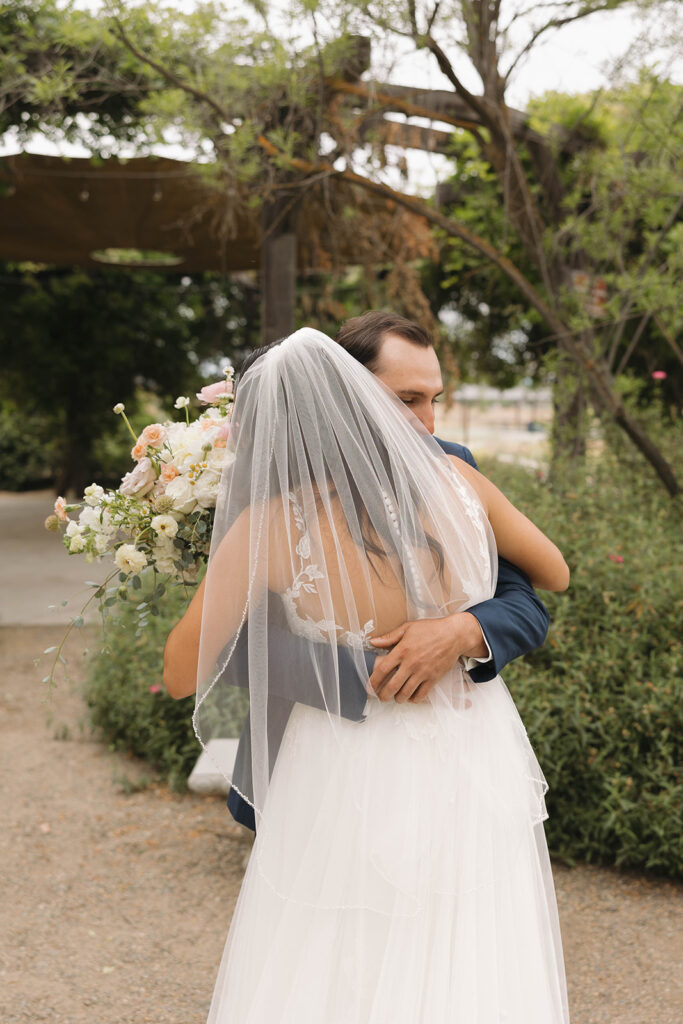 couple posing for  a first look
