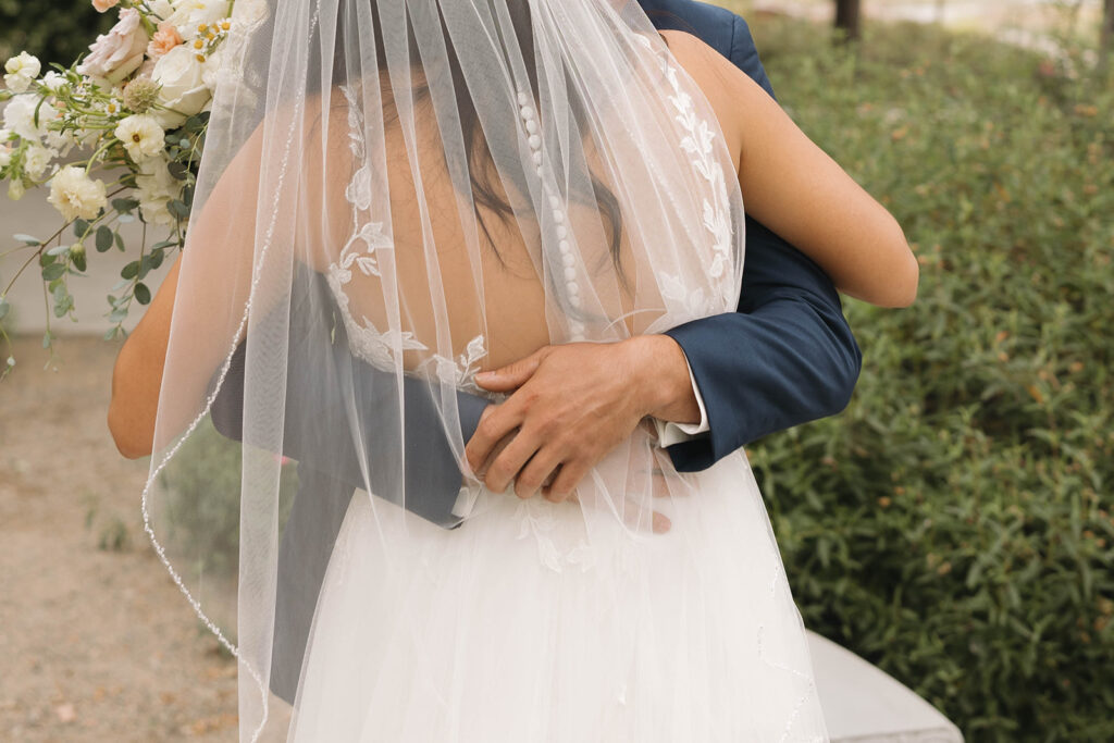  bride and groom having a first look photoshoot
