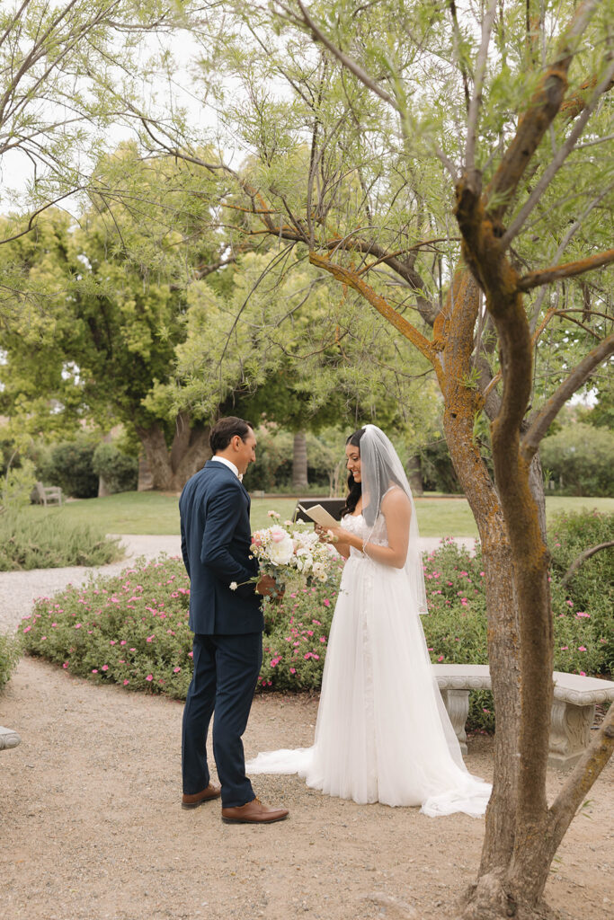 couple posing for  a first look
