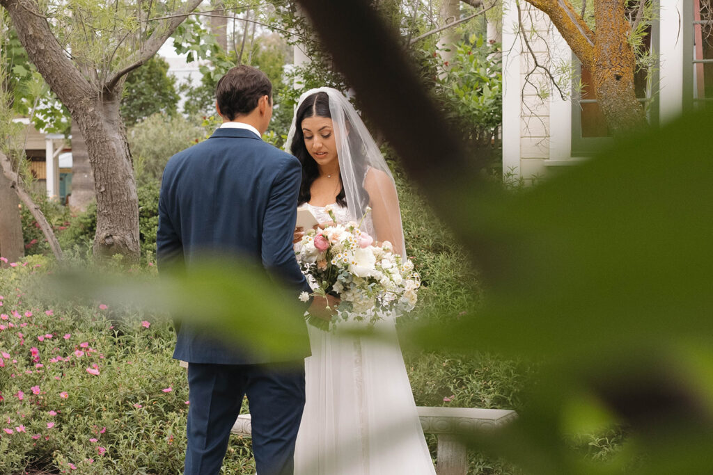  bride and groom having a first look photoshoot
