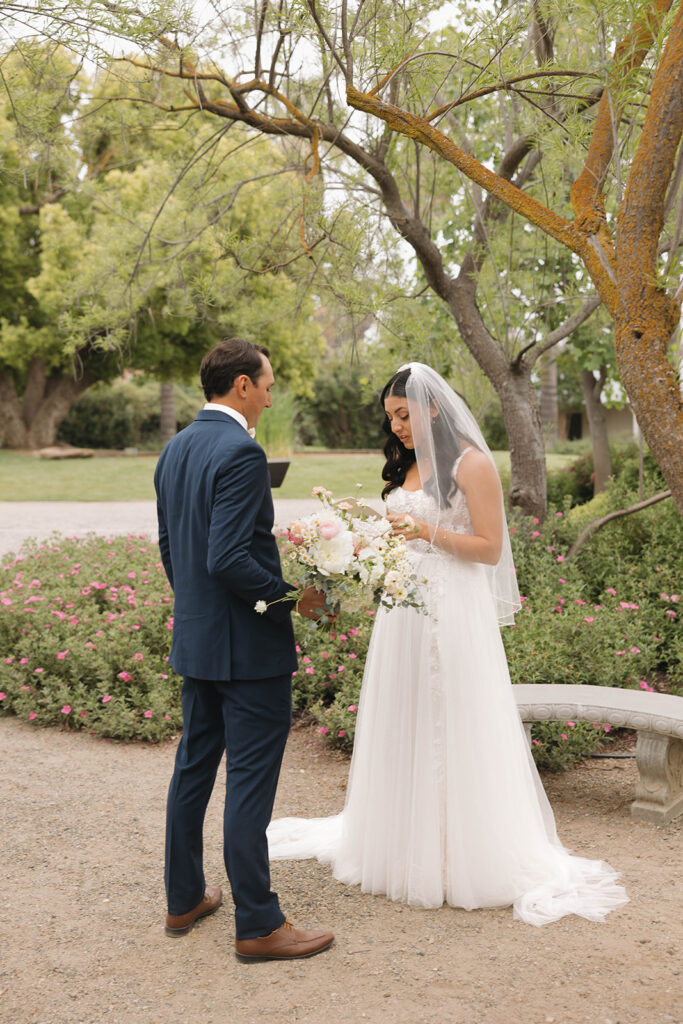 couple posing for  a first look
