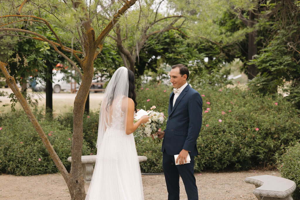 couple posing for  a first look
