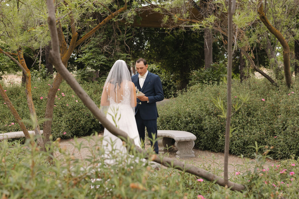  bride and groom having a first look photoshoot
