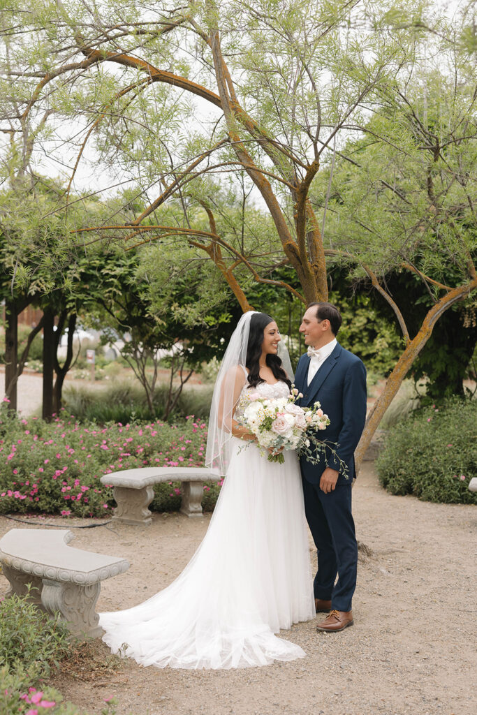  bride and groom having a first look photoshoot
