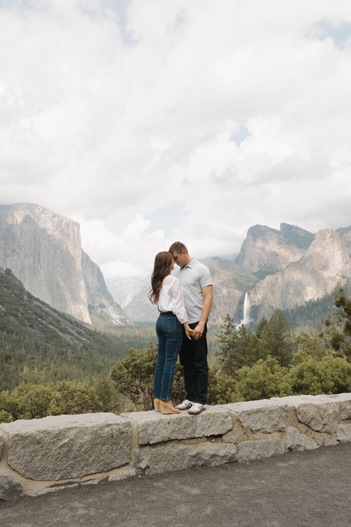 a couple having their engagement photos at yosemite natural park
