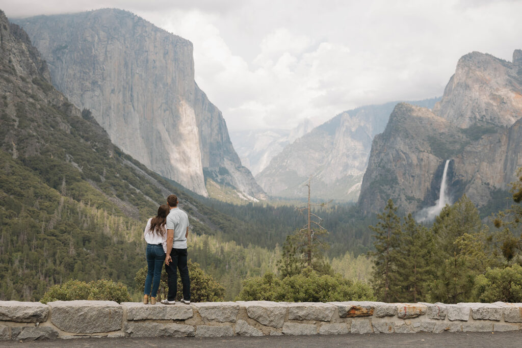 a couple having their engagement photos at yosemite natural park
