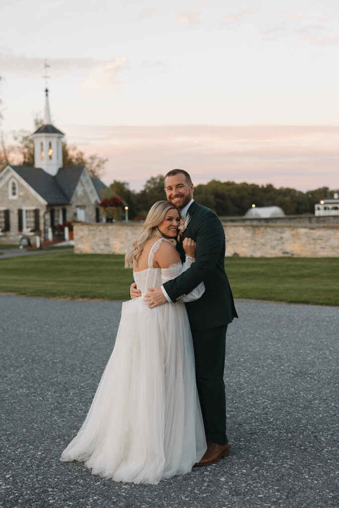 bride and groom posing for wedding photos
