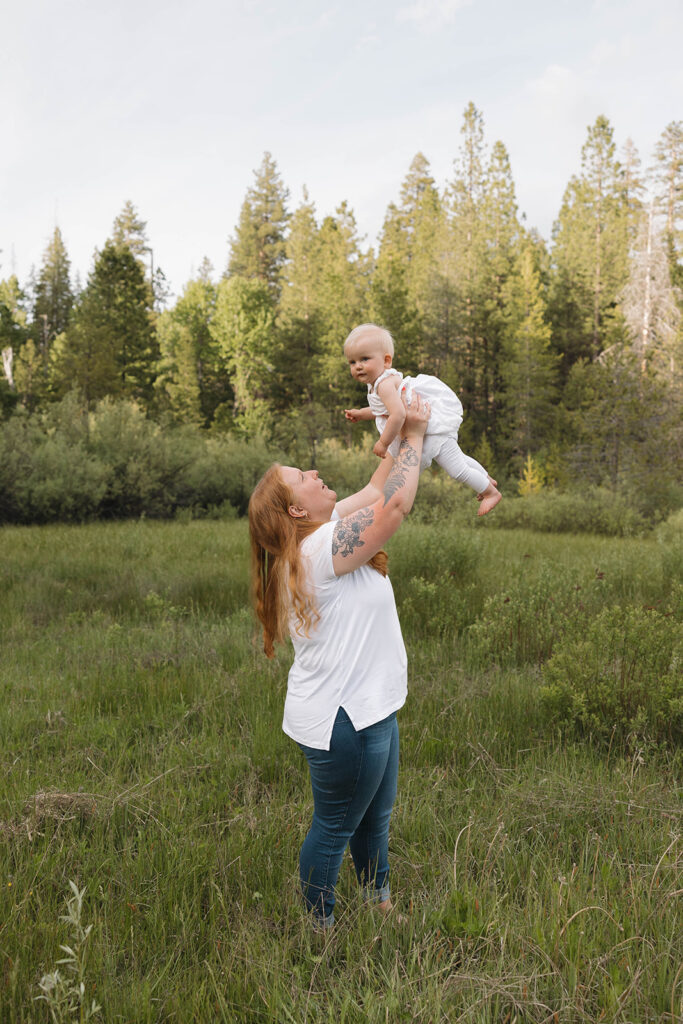 family taking pictures in a field
