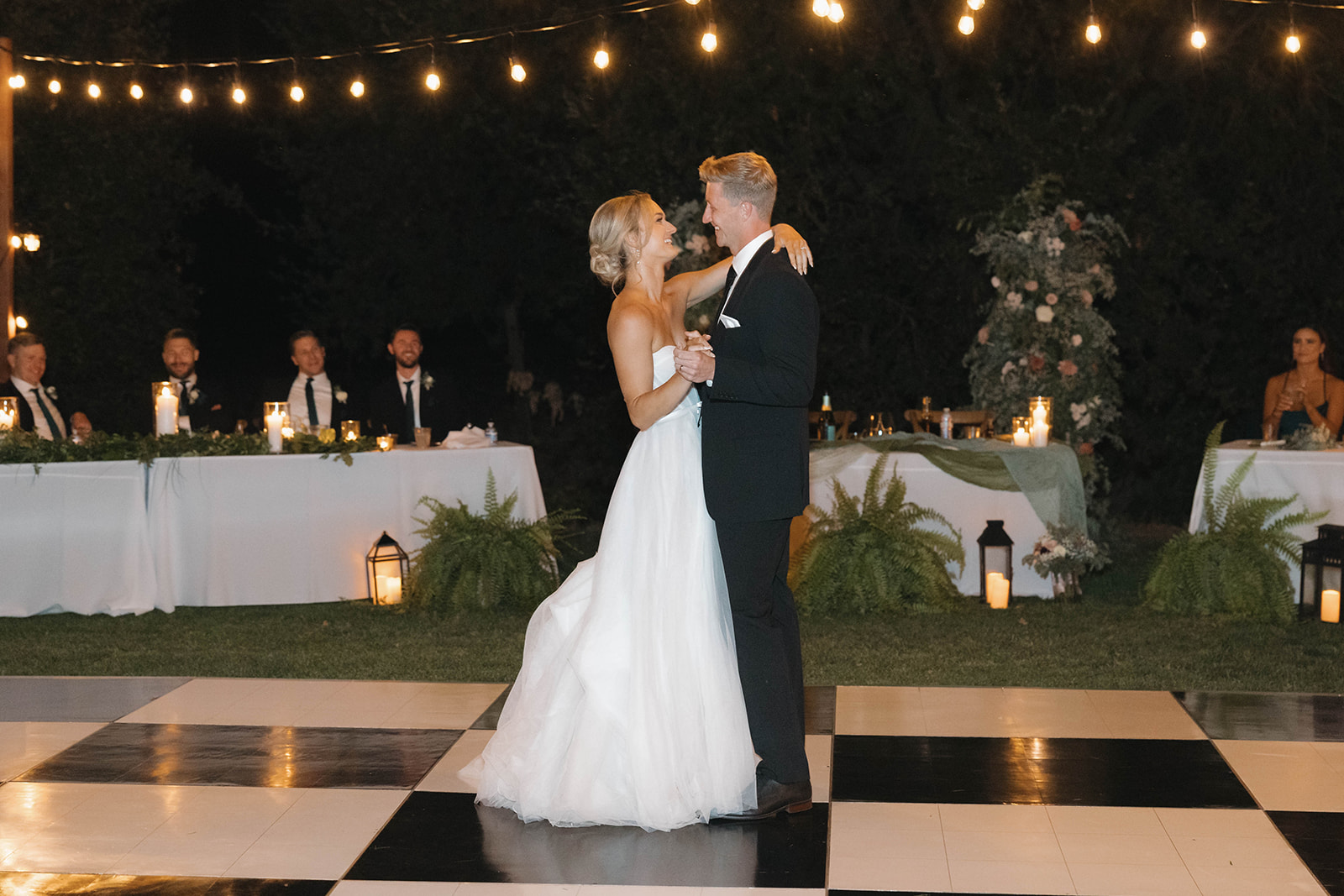 Sacramento wedding photographer documenting orchard wedding first dance at night