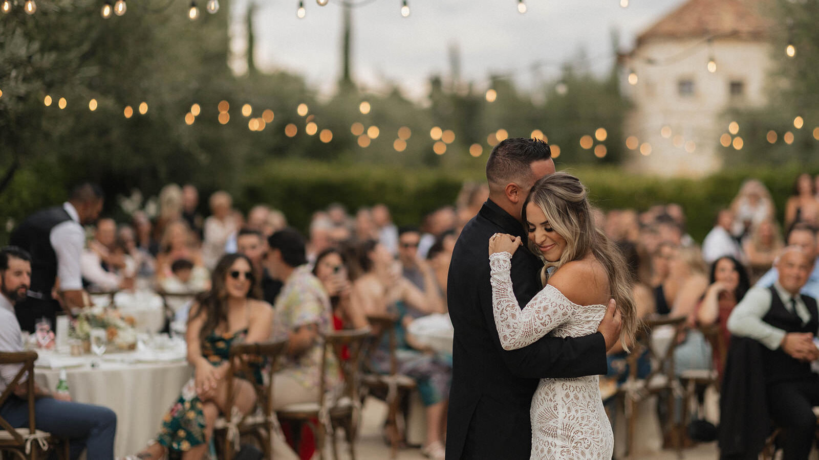 Wedding day timeline example of bride and groom dancing at the reception